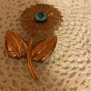 Vintage copper filigree flower pin with blue gem
